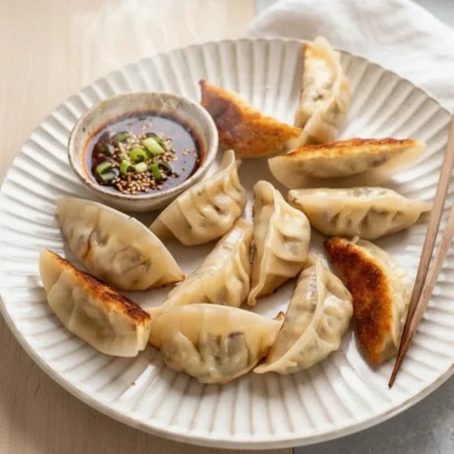 vegetarian dumplings recipe served in a white plate